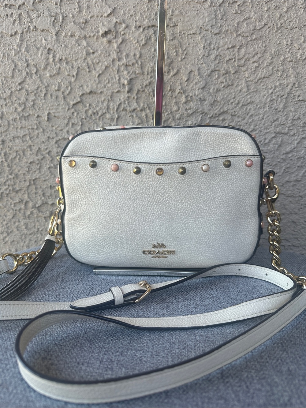 COACH Camera Bag features colorful mixed prairie rivets crossbody bag